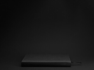 Black Book on Black Background Table Mockup