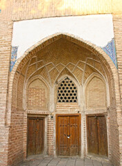 Uzbekistan, Bukhara, November 2019 - exterior of old  madrasah. Historical City Center of Bukhara. 