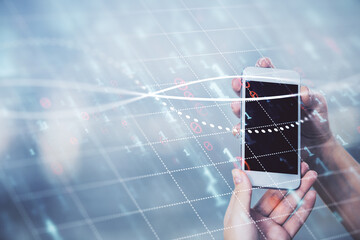 Double exposure of forex graph sketch hologram and woman holding and using a mobile device. Stock market concept.