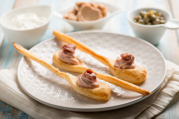 spoon canapes with tuna cream anchovies and capers