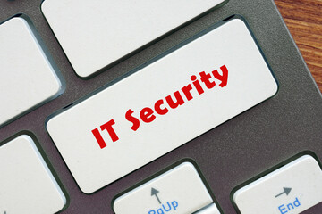  Financial concept about IT Security with inscription on the piece of paper.