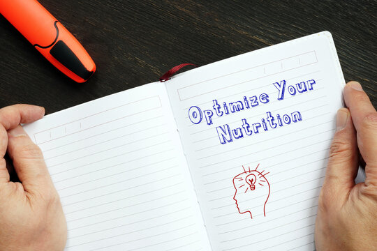 Conceptual photo about Optimize Your Nutrition with handwritten phrase.