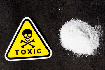 white chemical powder with toxic mark