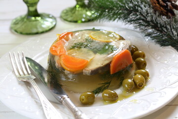 Jellied sturgeon with lemon, olives and glasses of white wine