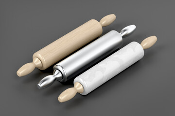 Three rolling pins from different materials on grey background