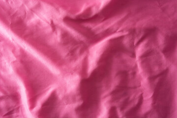 Pink wrinkled cloth background. Copy space