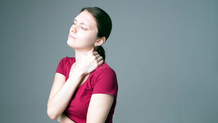 Tired woman feeling pain, massaging tense muscles