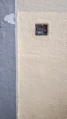 the surface of the wall on which the red button is located. texture.