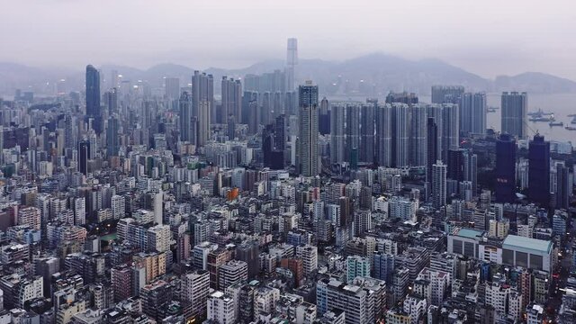 Aerial overhead view of city at sunset, residential district in Kowloon, Hong Kong