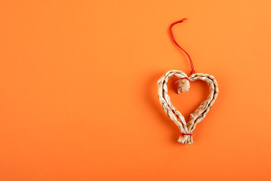 Heart shape decoration. Orange background for text and pictures. Copy space, mock up