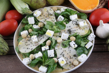 arugula pear and feta salad as vegan healthy food
