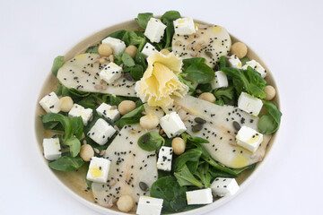 arugula pear and feta salad as vegan healthy food