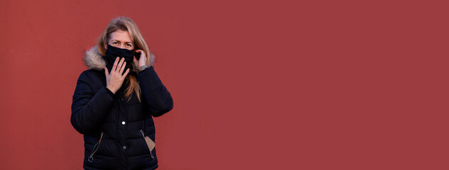 Middle age woman wearing coronavirus protection mask for covid-19 epidemic virus © tetxu