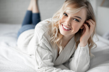 Portrait of a happy young woman at home