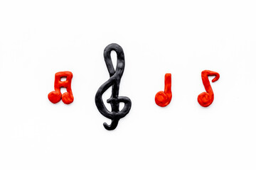 Top view of music notes made of rubber. Music abstract background