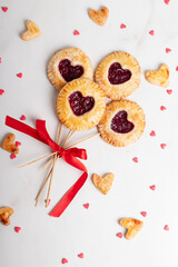 Small cherry pies pops on sticks on Valentine's Day. Place for text or advertising. Postcard