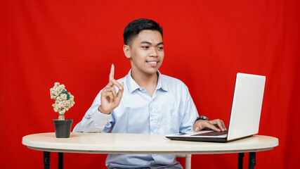 Asian business man thingking and get idea isolated red background