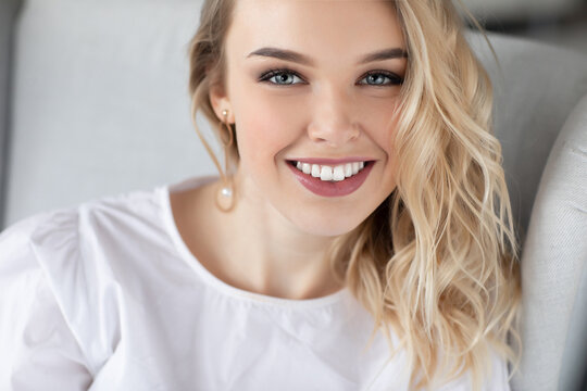 Portrait of a happy young woman at home