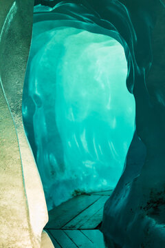 blue ice inside a cave under melting rhone glacier