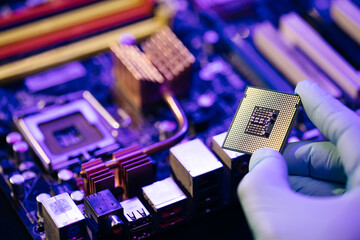 Laboratory technician holds a powerful processor in his hands. CPU computer processor. CPU socket...