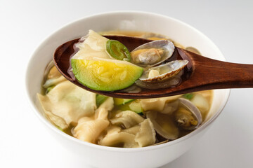 Cooking clam flour broth on a white background