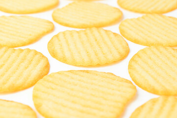 Potato chips on white background