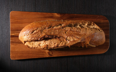 french baguette on a dark background, bread