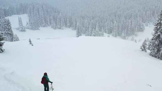 Aerial drone 4k clip of a skier touring in Bucegi mountains, Carpathian range
