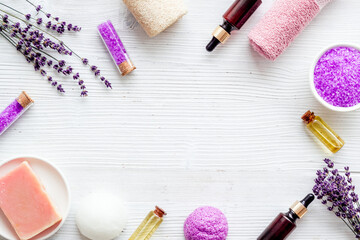 Fototapeta na wymiar Frame of beauty treatment -lavender bath salt and essential oil