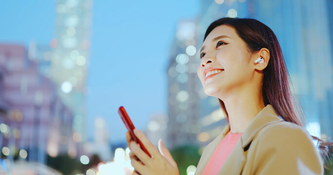 Woman Use Ear Buds Outdoor