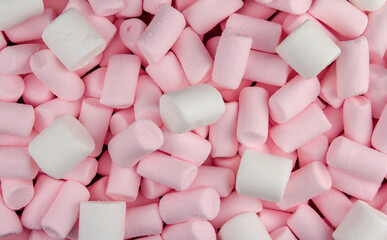 A bunch of pink and white marshmallows.