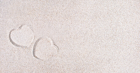 Fototapeta na wymiar A heart symbol imprint on sand, copy space, banner, tropical summer background