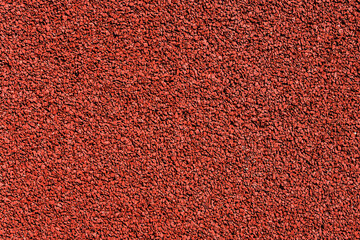 Red grain texture. Noise background. Grainy color tarmac design.