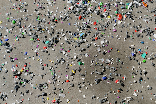 Multicolor glass shards on sand
