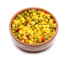 Mexican salad in clay bowl, vegetables mix with corn, peas and paprika isolated on white background