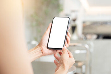 cell phone blank white screen mockup.woman hand holding texting using mobile on desk at office.background empty space for advertise.work people contact marketing business,technology