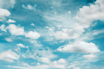 Heaven background. Cloudy sky background. Peaceful bright blue sky texture. Fluffy clouds on the sky background. Cloudscape view.
