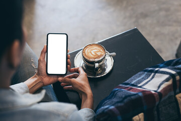 cell phone blank white screen mockup.woman hand holding texting using mobile on desk at office.background empty space for advertise.work people contact marketing business,technology