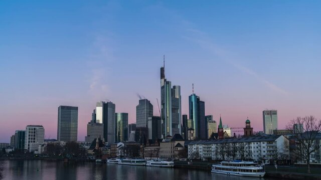 Light shining Frankfurt skyline, sunrise over financial district near the Main