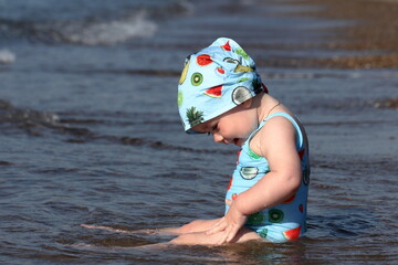 child playing on the beach