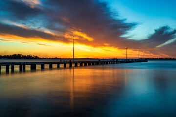 Fototapeta na wymiar Dramatic Sky Sunset at Como Beach Jetty, Perth