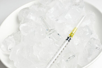 Vaccine storage fridge. Vials on the ice. Long-term storage of Covid-19 vaccine. Coronavirus...