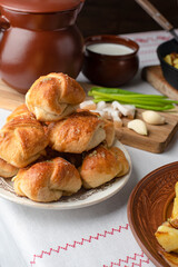 Ukrainian or Russian traditional feast. Garlic buns. Fried potatoes with bacon. Copy space