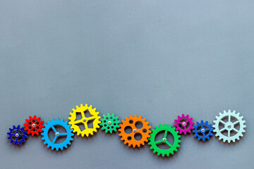 Working gears connect into puzzle, top view. Teamwork and collaboration concept