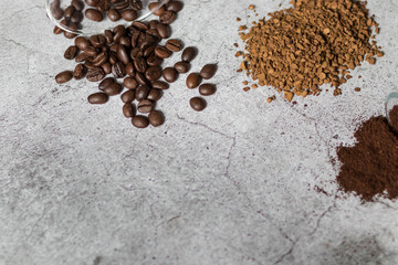 
Instant coffee, coffee beans and ground coffee.All this on a gray background