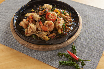 Spicy Stir Fried Seafood Served on a hot pan Popular dishes in Thailand