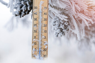 Thermometer in winter, which shows the freezing point. Temperature outside measured in degrees...