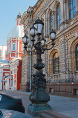 Fototapeta premium St. Petersburg - an old lantern at the building of the Stieglitz Museum and the Panteleimon Church. 