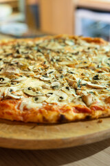 italian pizza with wood plate on bar counter