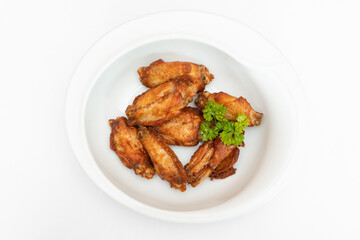 Baked chicken wings with parsley.